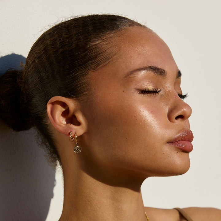 Goldene Sonnenohrringe