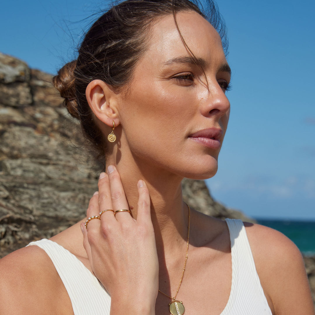 Goldene Sonnenohrringe