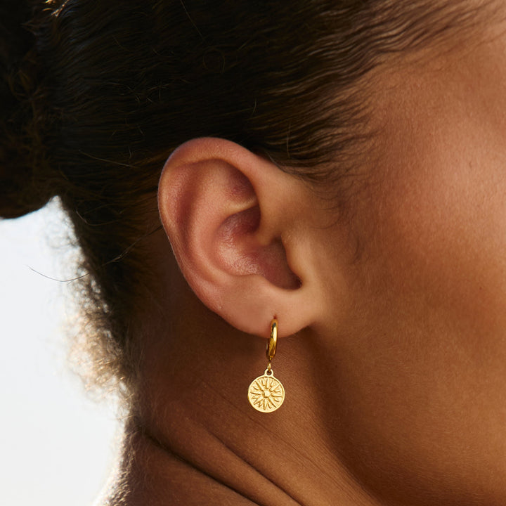 Goldene Sonnenohrringe